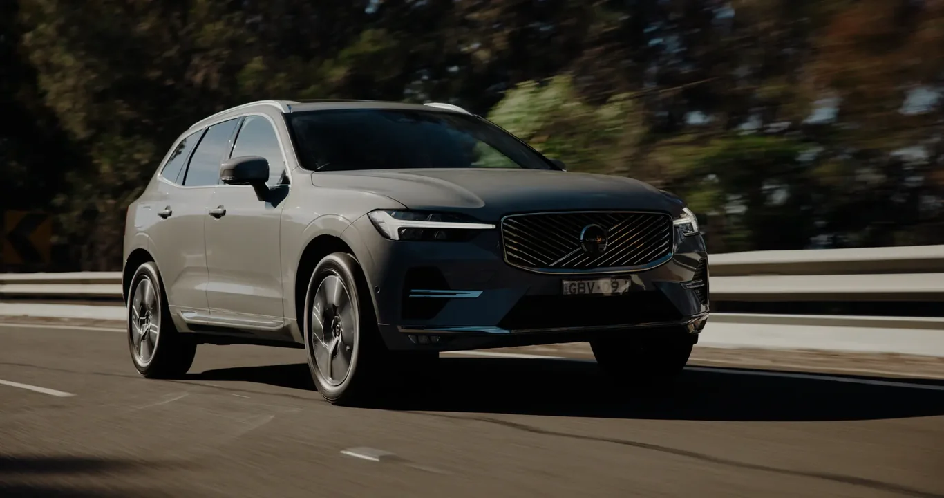 Volvo XC60 on a scenic coastal road, mid-journey north from Sydney