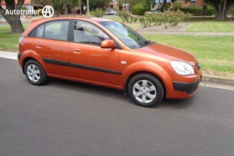 Orange 2009 Kia RIO Hatchback Lx