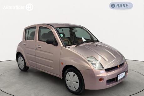 Pink 2000 Toyota Will Sedan VI