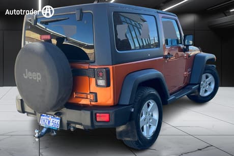 Orange 2012 Jeep Wrangler Softtop Sport (4X4)