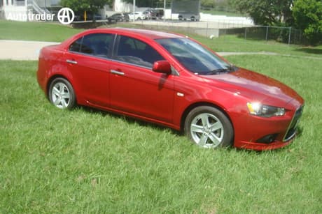 Red 2015 Mitsubishi Lancer Sedan Lx