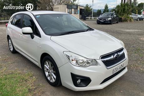 White 2012 Subaru Impreza Hatchback 2.0I-L (Awd)