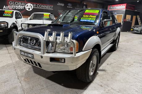 Blue 2010 Nissan Navara Dual Cab Pick-up St-R (4X4)