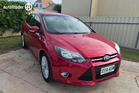 Red 2011 Ford Focus Sedan Sport