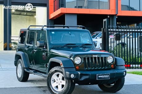 Green 2011 Jeep Wrangler Softtop Unlimited Sport (4X4)