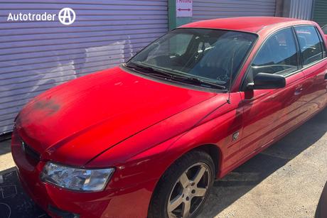 Red 2004 Holden Crewman Crew Cab Utility