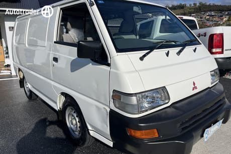 White 2010 Mitsubishi Express Commercial