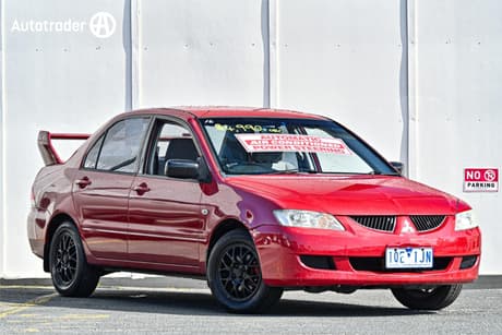 Red 2003 Mitsubishi Lancer Sedan Es