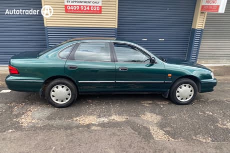Green 2000 Toyota Avalon Sedan Conquest