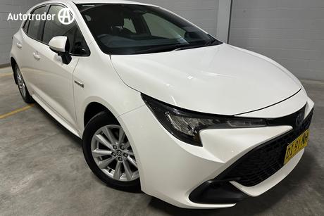 White 2023 Toyota Corolla Hatchback Ascent Sport + Conv Pk Hybrid