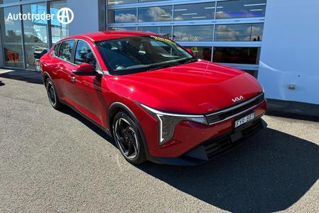 Red 2025 Kia K4 Sedan Sport