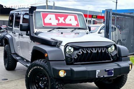 Silver 2011 Jeep Wrangler Softtop Unlimited Sport (4X4)