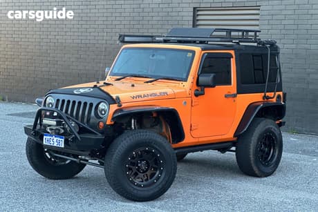 Orange 2012 Jeep Wrangler Softtop Sport (4X4)