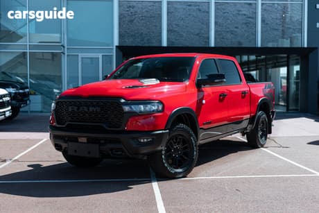 Red 2025 RAM 1500 Crew Cab Utility Rebel Hurricane