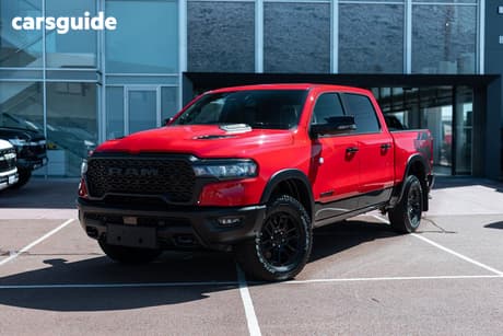 Red 2025 RAM 1500 Crew Cab Utility Rebel Hurricane