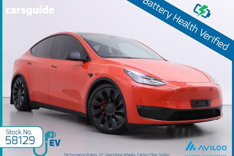 Orange 2023 Tesla Model Y Wagon Performance