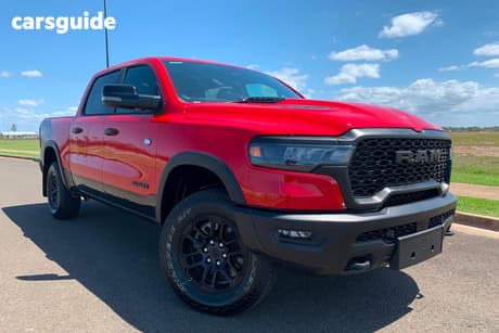Red 2025 RAM 1500 Crew Cab Utility Rebel Hurricane