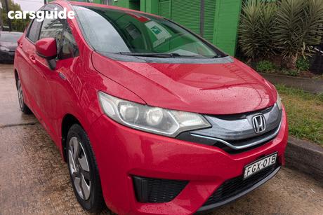 Red 2015 Honda Fit Hatchback (Hybrid)
