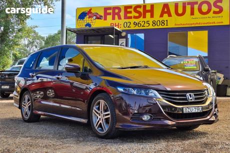 Red 2011 Honda Odyssey Wagon Luxury