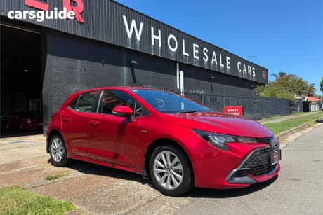Red 2024 Toyota Corolla Hatchback Ascent Sport Hybrid