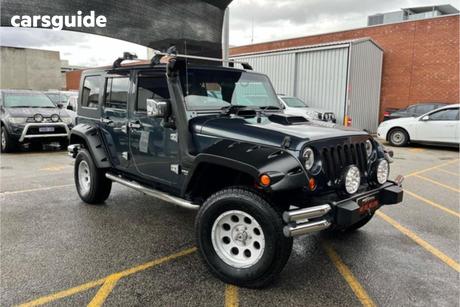 Black 2011 Jeep Wrangler Softtop Sport (4X4)