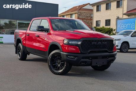 Red 2025 RAM 1500 Crew Cab Utility Rebel Hurricane