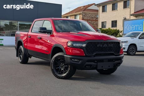 Red 2025 RAM 1500 Crew Cab Utility Rebel Hurricane