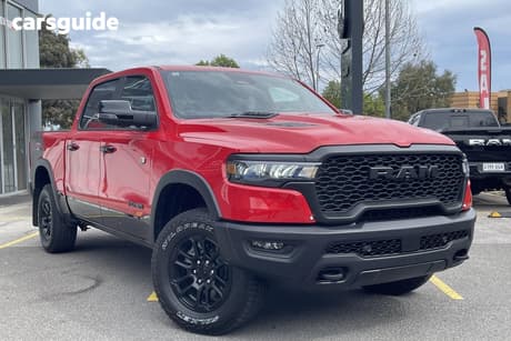 Red 2025 RAM 1500 Crew Cab Utility Rebel Hurricane