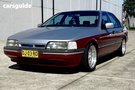 Red 1992 Ford Fairmont Sedan