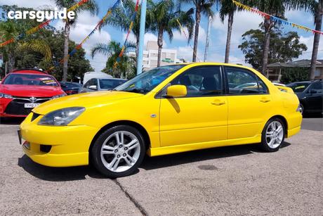 Yellow 2004 Mitsubishi Lancer Sedan Vr-X