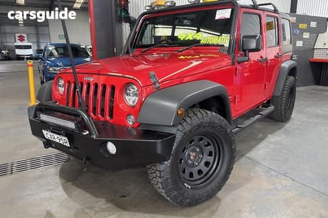 Red 2015 Jeep Wrangler Unlimited Softtop Sport (4X4)
