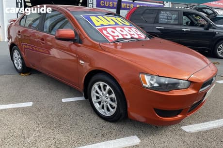 Orange 2011 Mitsubishi Lancer Sedan Sx