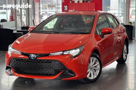 Orange 2025 Toyota Corolla Hatchback Ascent Sport Hybrid