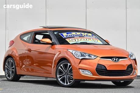 Orange 2015 Hyundai Veloster Coupe +