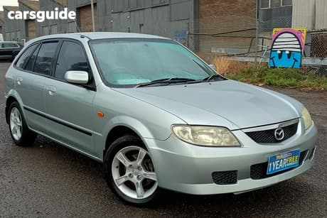 Silver 2003 Mazda 323 Hatchback Astina Shades