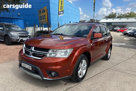 Orange 2013 Dodge Journey Wagon Sxt