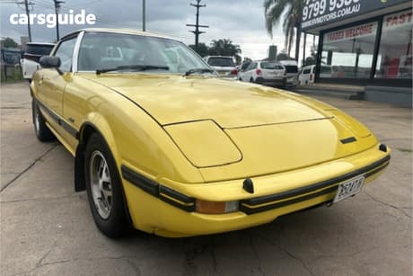 Yellow 1982 Mazda RX-7 Coupe Super Deluxe