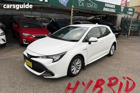 White 2023 Toyota Corolla Hatchback Ascent Sport Hybrid