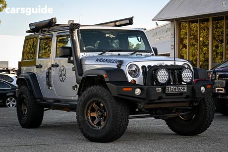 Silver 2012 Jeep Wrangler Softtop Unlimited Sport (4X4)