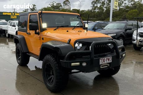 Yellow 2012 Jeep Wrangler Softtop Sport (4X4)