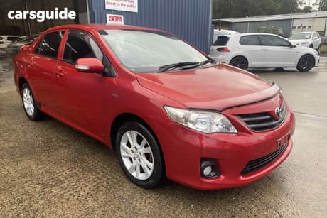 Red 2012 Toyota Corolla Sedan Ascent Sport