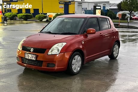 Orange 2006 Suzuki Swift Hatchback