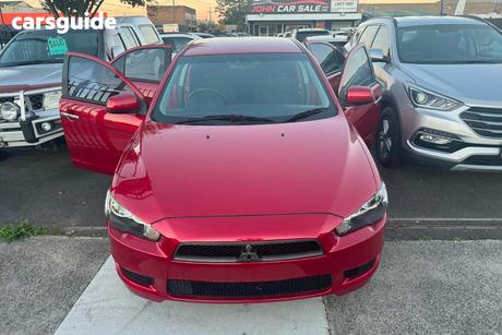Red 2010 Mitsubishi Lancer Sedan Es