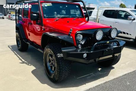 Red 2015 Jeep Wrangler Unlimited Softtop Freedom Iv (4X4)