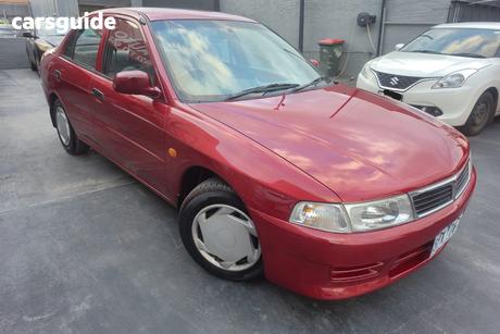 Red 2002 Mitsubishi Lancer Sedan Gli