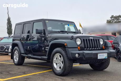 Black 2014 Jeep Wrangler Softtop Unlimited Sport (4X4)