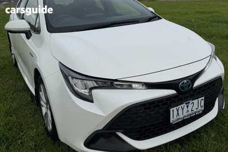 White 2023 Toyota Corolla Hatchback Ascent Sport + Conv Pk Hybrid