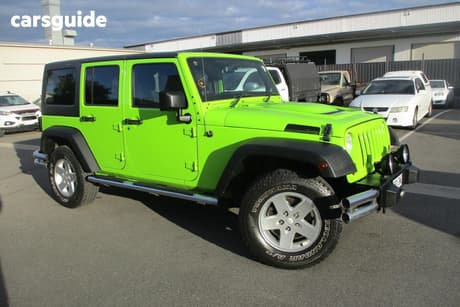 Green 2012 Jeep Wrangler Softtop Unlimited Sport (4X4)
