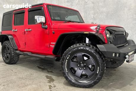 Red 2012 Jeep Wrangler Softtop Unlimited Sport (4X4)