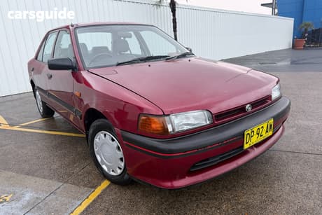 Burgundy 1994 Mazda 323 Sedan